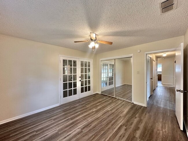 Building Photo - Spacious 4-Bedroom Home on a Corner Lot wi...