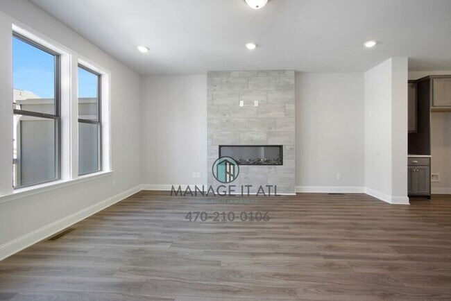 Building Photo - Modern 3-level Townhome featuring 4 bedrooms and 3 1/2 baths