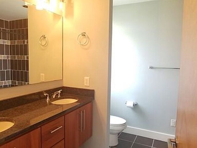 Master bathroom with double sinks. - 300 Van Buren St