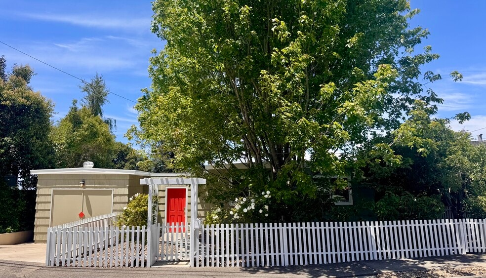 This 1952 bungalow has striking curb appeal with mature trees, private fenced frontage, and a welcom - 2403 Mira Vista Dr