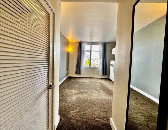 Building Photo - Corner Light. City Energy. Zero Compromise.