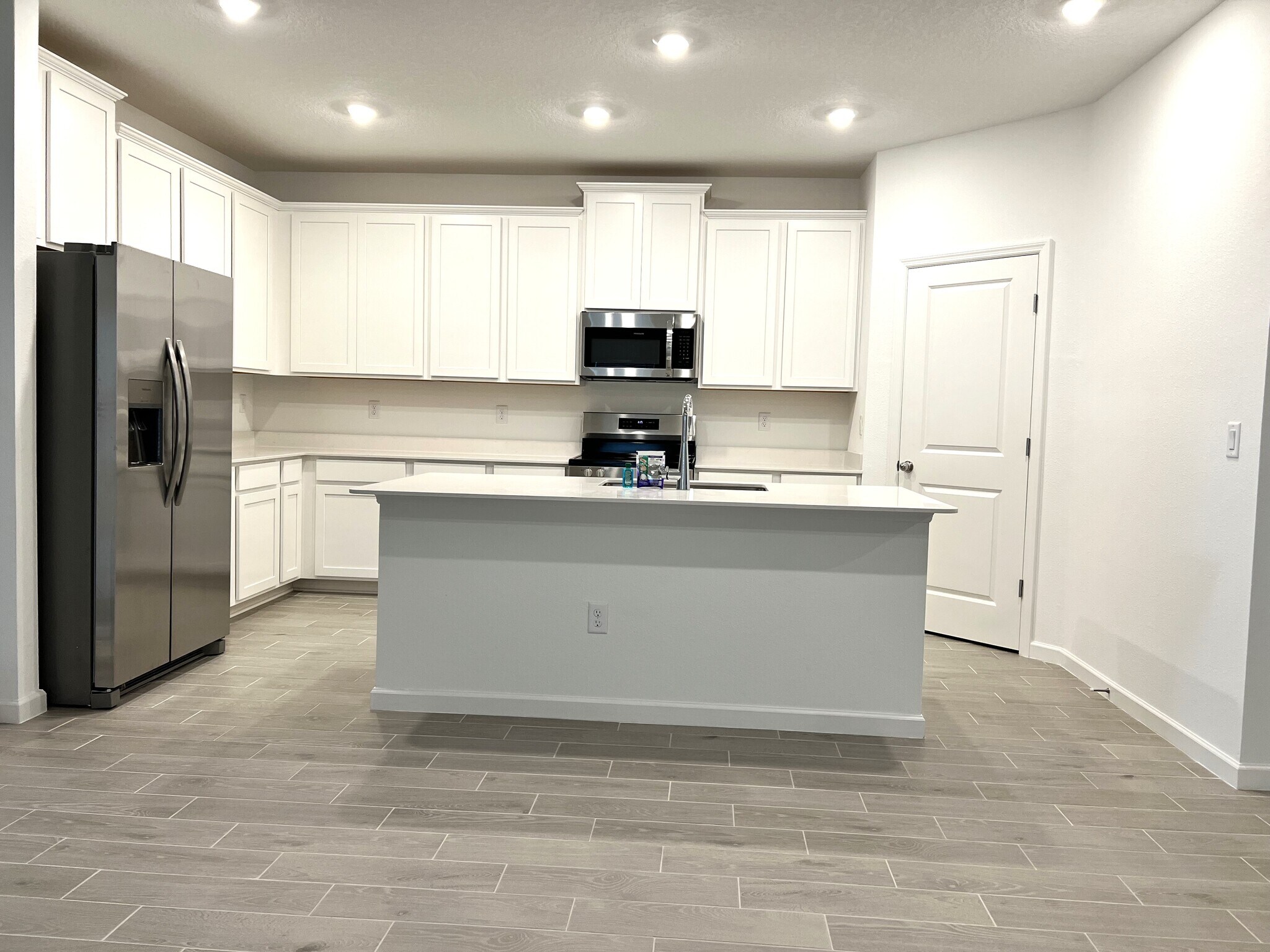 Kitchen view from Living Room - 15542 Whispering Fir Dr