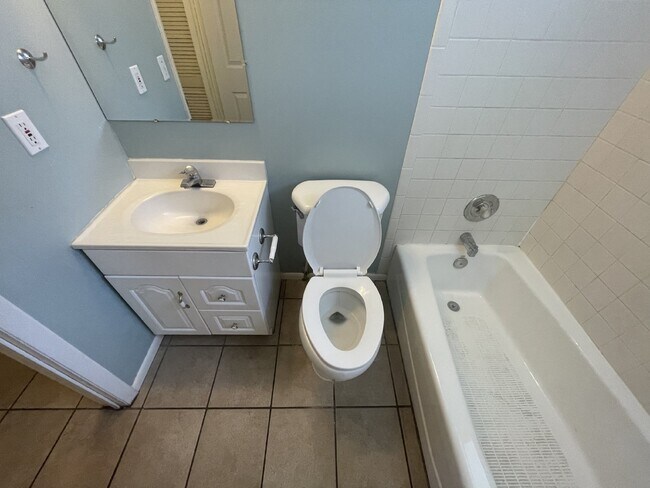 Building Photo - Spacious 6-Bed Oasis with Finished Basement & Cozy Fireplace.