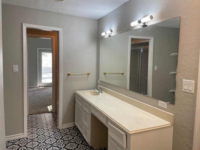 Updated primary bath with separate shower and commode - 1925 Driskill St