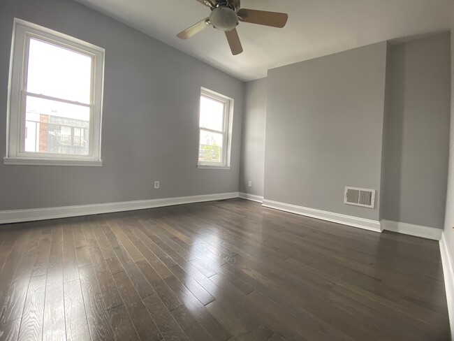 Upstairs master bedroom, hardwood floor, ceiling fan - 1618 Fitzwater St