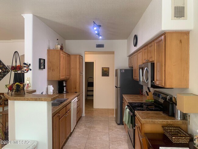Building Photo - 7050 E Sunrise Dr