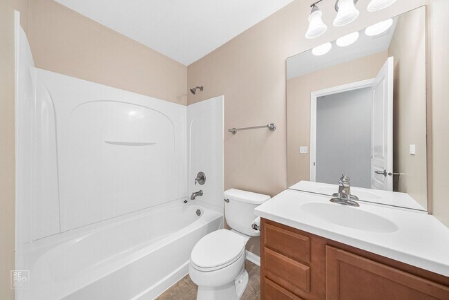 Building Photo - AUTUMN CREEK SECOND FLOOR CONDO WITH TWO CAR GARAGE