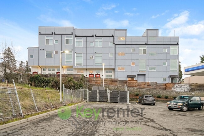 Building Photo - Rooftop Living with Open Concept Design and Parking Included