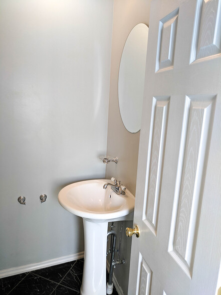 first floor half bath - 2823 Chatham St