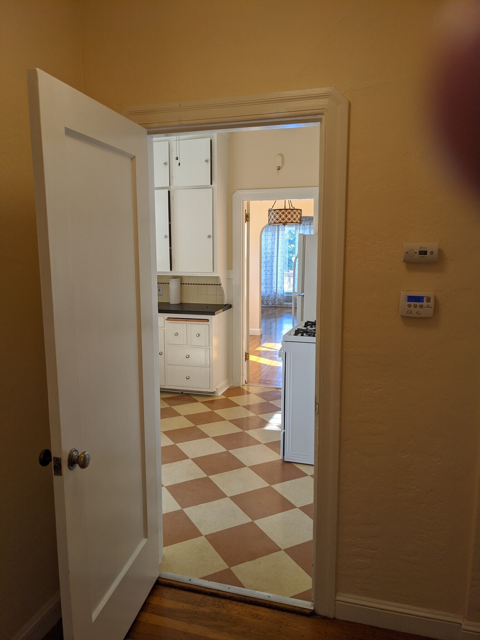 View from hallway through kitchen to living room - 422 Capitol St