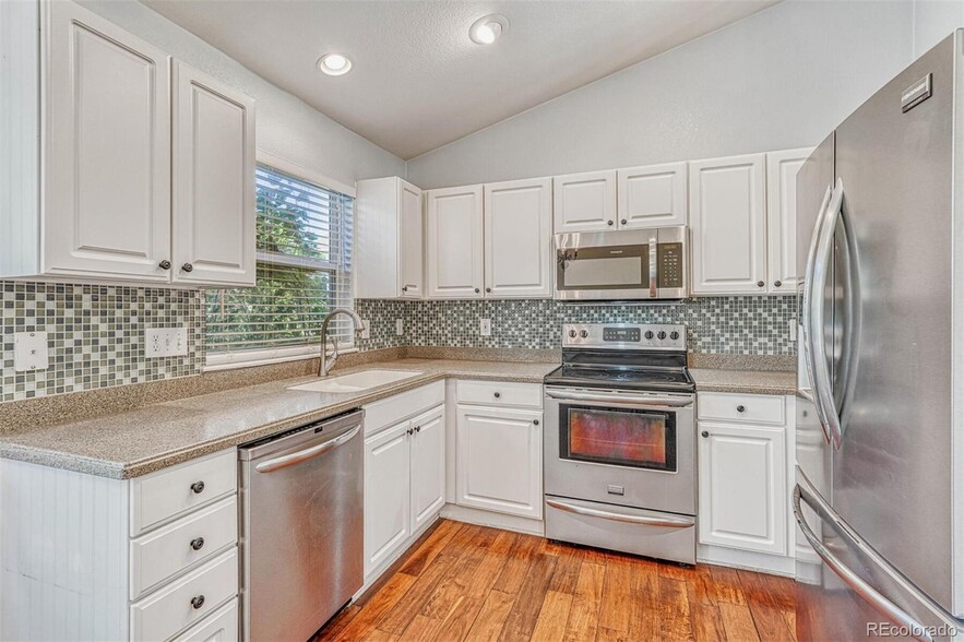 Nicely updated kitchen with stainless steel appliances - 16441 Martingale Dr