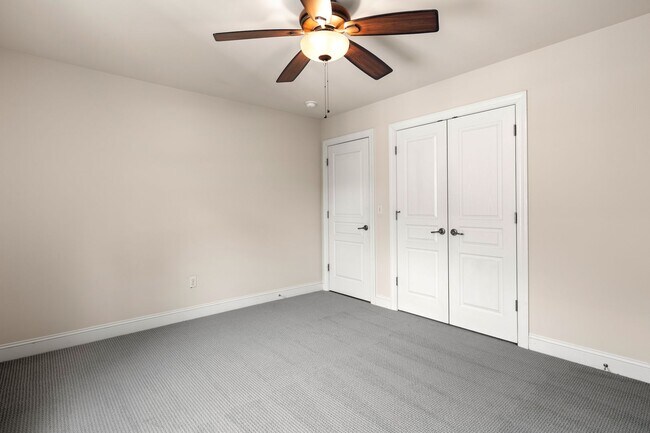 Building Photo - Five-Bedroom Tudor Home with Main-Level Primary Suite in Albemarle Reserve