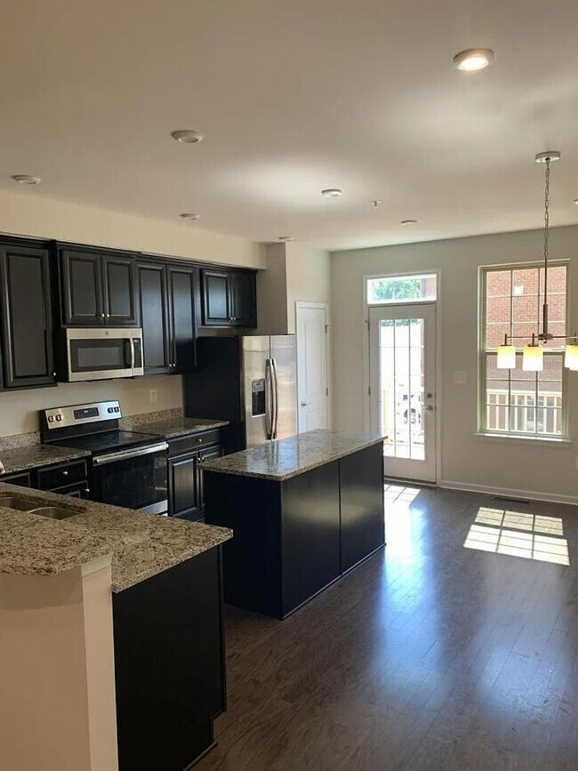 Building Photo - Modern 2BR + Office Townhome with Garage &...