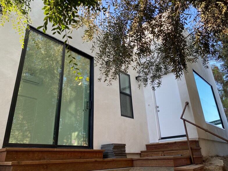 Private and secluded entrance with a clay brick patio off the sliding doors to the bedroom. - 4435 Radium Dr