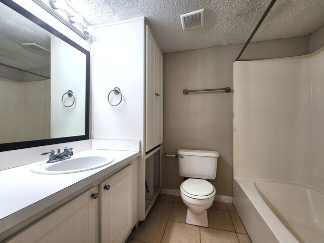 Building Photo - Ground Floor End-Unit; New Paint; All-Tile...
