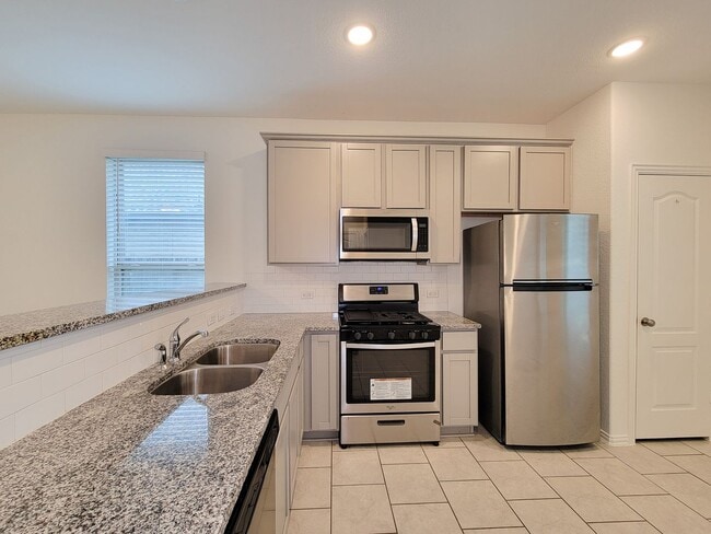 Building Photo - Discover this charming single-story home, ...