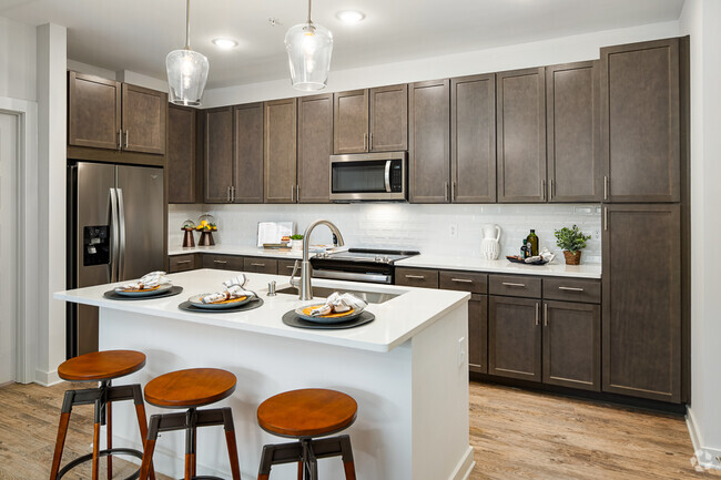 Model Kitchen with Espresso Cabinetry and Stainless Steel Appliances
