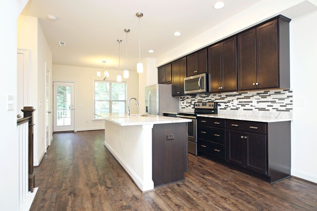 Building Photo - Light-Filled Townhome With Utilities Inclu...