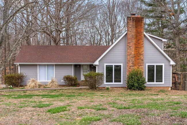 Building Photo - Lovely home on beautiful, wooded corner - Just Reduced