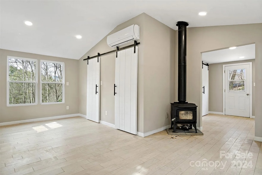 Living area looking towards storage closet and bedroom door. - 228 Barrett Rd