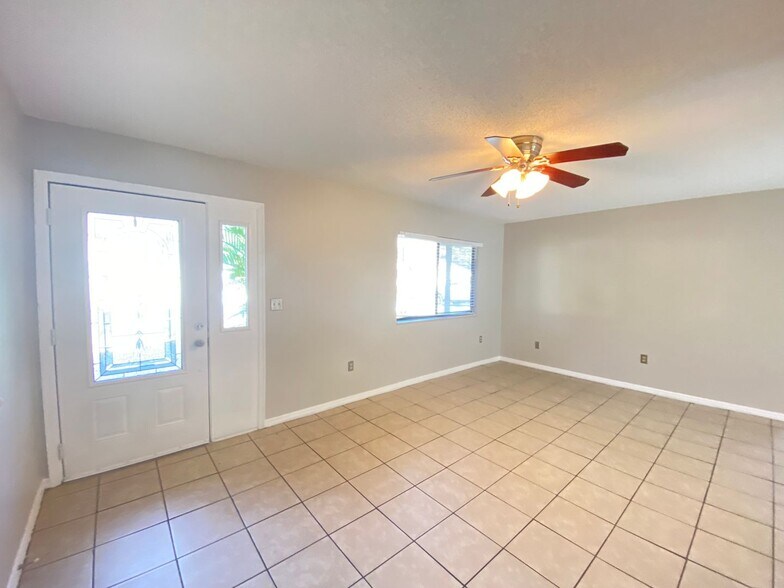 Building Photo - 2/2 home with garage - tile on inside with...