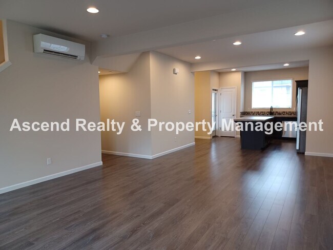 Building Photo - 3 Level End Unit Townhome with Newer Carpet, Open Floor Plan, 2 Balconies, 2 Car Attached Garage ...