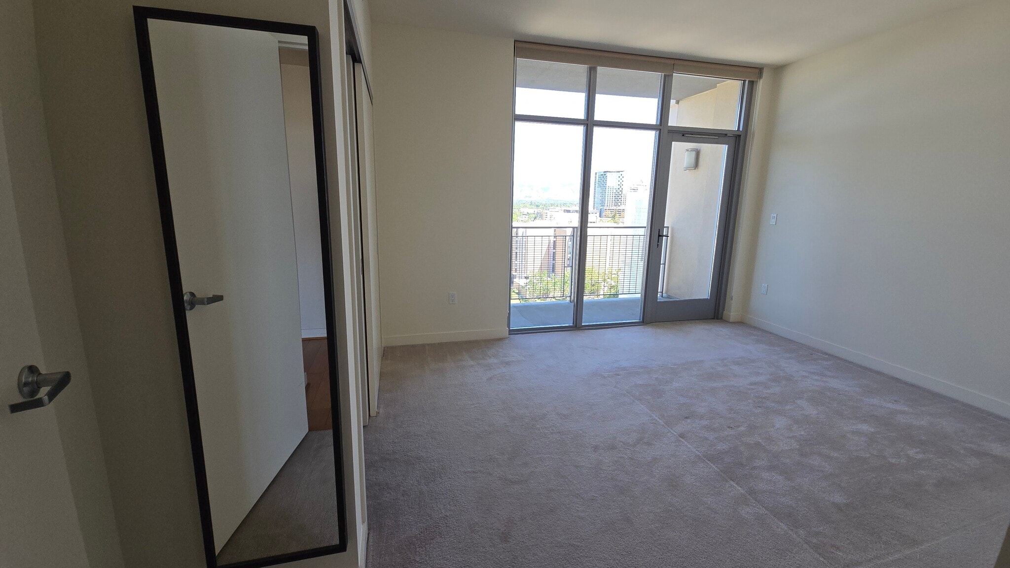 Master bedroom floor-to-ceiling window with private balcony - 175 W Saint James St