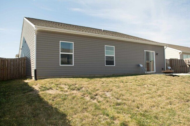Building Photo - House with Fenced Backyard