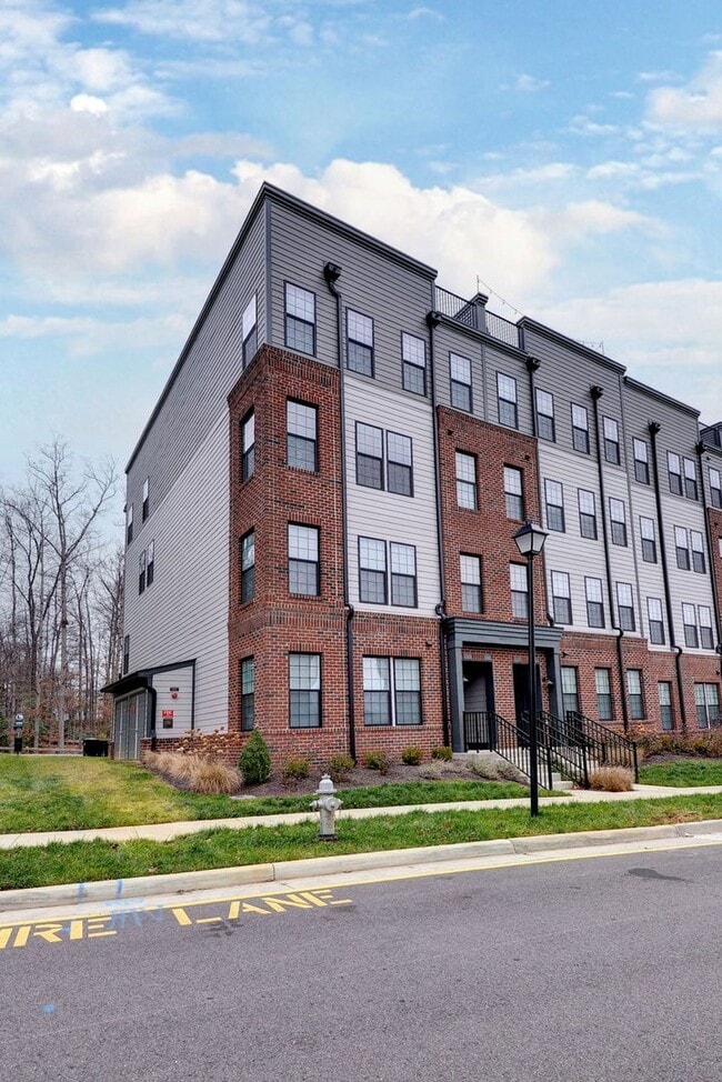 Building Photo - Three Story Brick End Unit with Rooftop Terrace