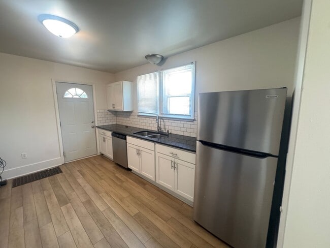 Building Photo - Updated Three Bedroom Home on the NE side ...
