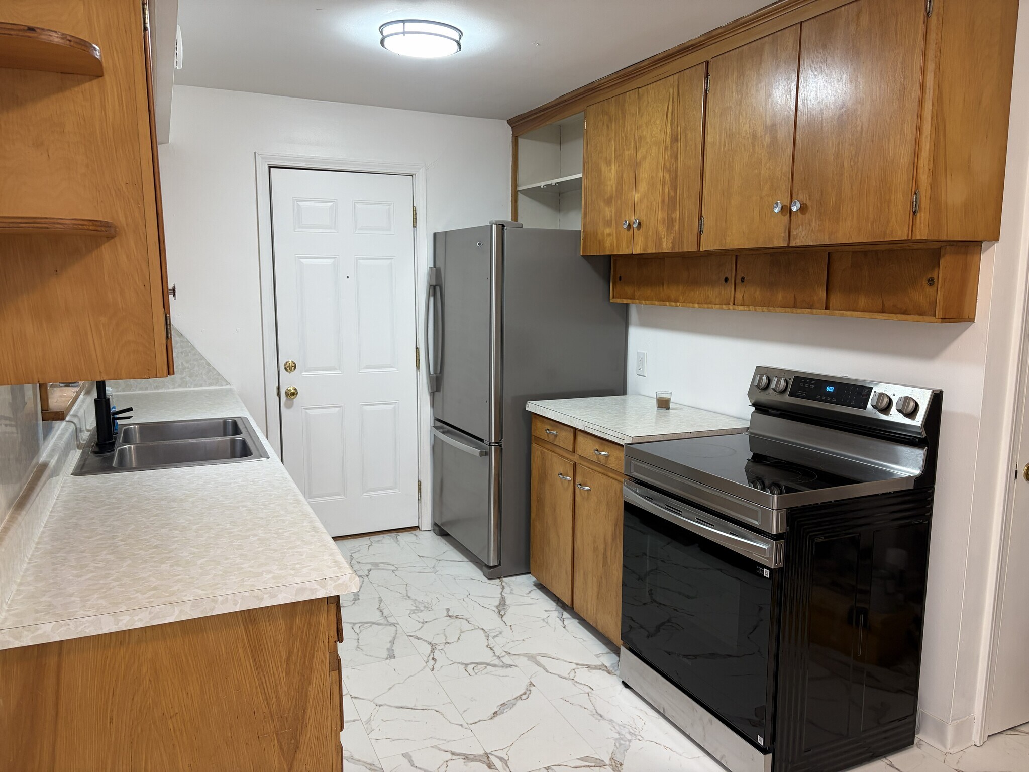 Kitchen. Fridge, Range, and Dishwasher included - 1233 29th St NE