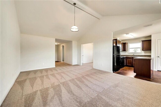 Building Photo - This lovely 4 bedroom home features a large family room with lots of light.