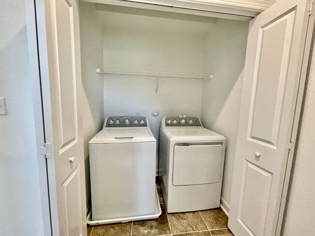 Building Photo - Practically New & Available NOW! Americana Luxury Townhomes! Pet Friendly! Attached Garage! All A...