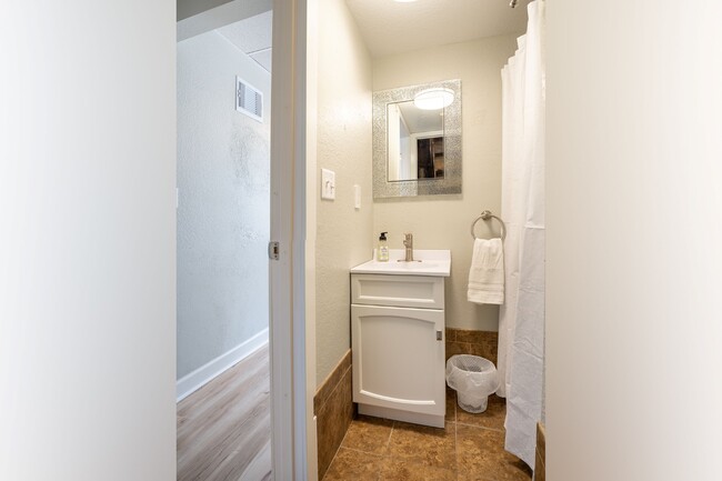 Main floor bathroom with shower. - 222 6th Ave SE