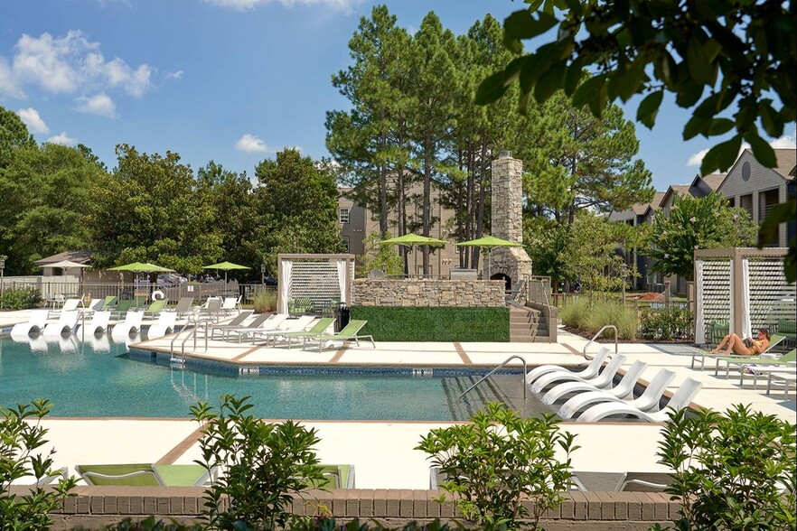 Relax by the resort-style pool with private cabanas and enhance your off-campus living experience at The Preserve at Tuscaloosa. - The Preserve at Tuscaloosa