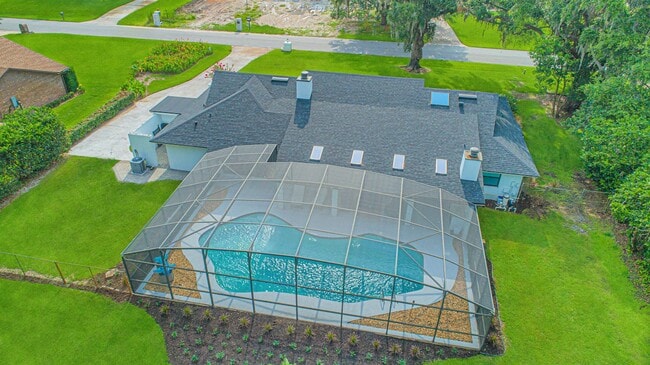 Building Photo - Beautifully Updated 3/2 Pool Home with Large Backyard in Lake Ajay (Gated Community)