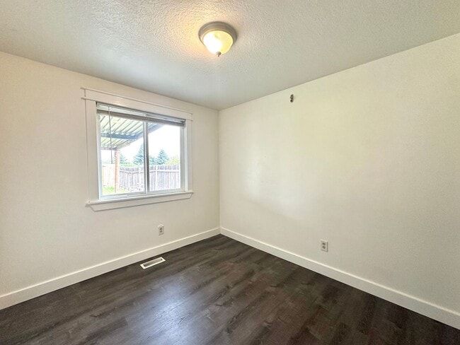 Building Photo - Three bedroom home with large fenced yard