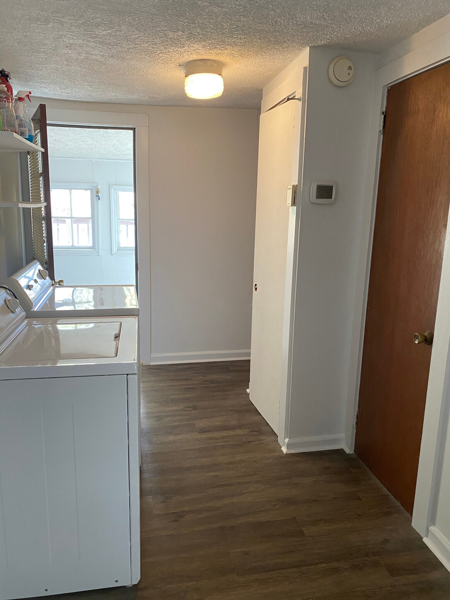 Laundry in unit; leads out to sunroom/deck - 105 Hill St NE