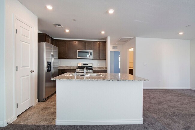 Building Photo - Newer Townhome - 3 Bedrooms + 2 Car Garage - E Craig & Nellis