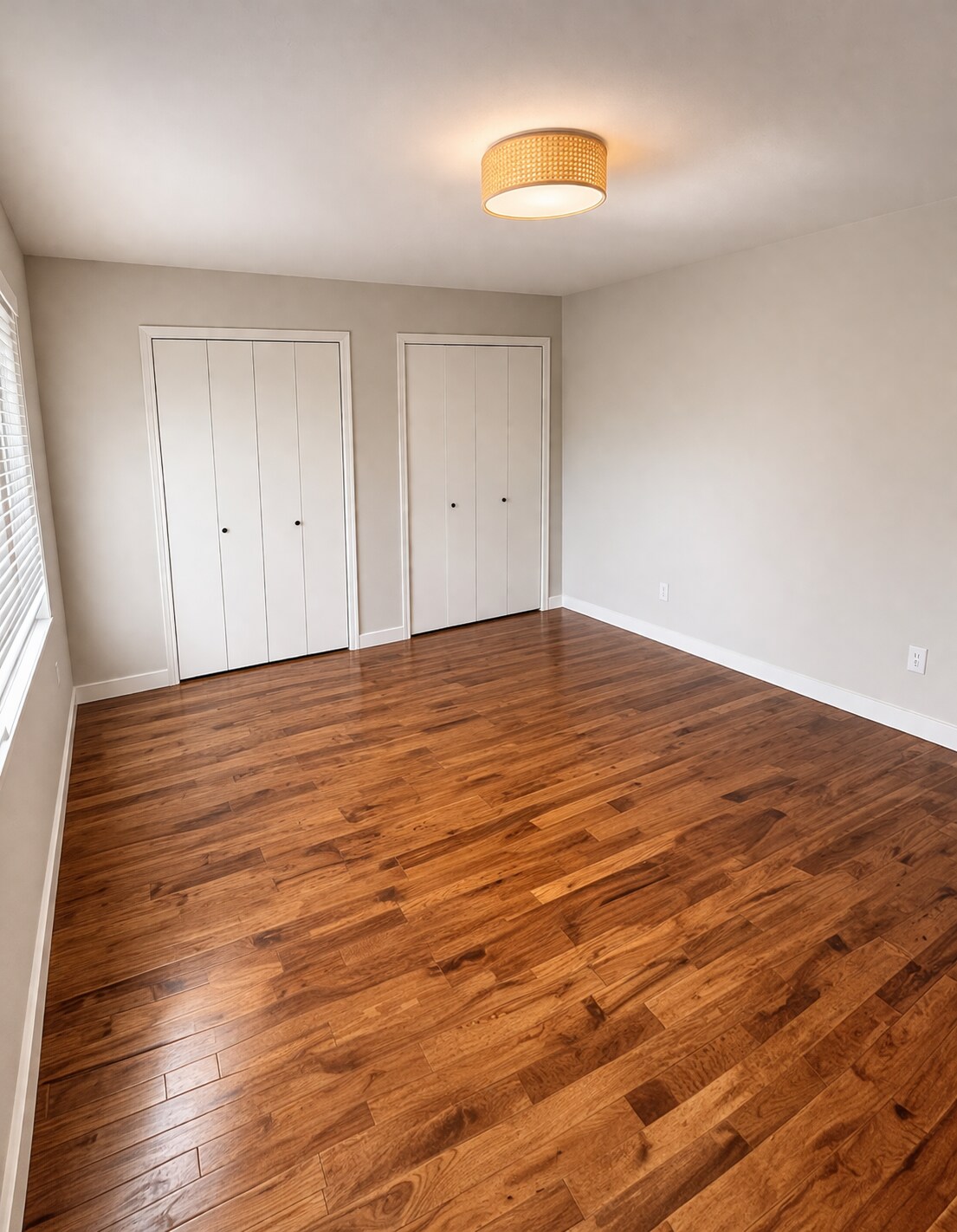 Spacious primary bedroom with generous closet space and room for a desk or seating area. - 524 Superior St