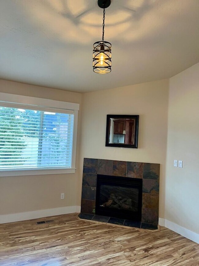 Building Photo - THREE-CAR GARAGE! This charming home offers 3 bedrooms, plus an office/rec room, and 2 bathrooms.