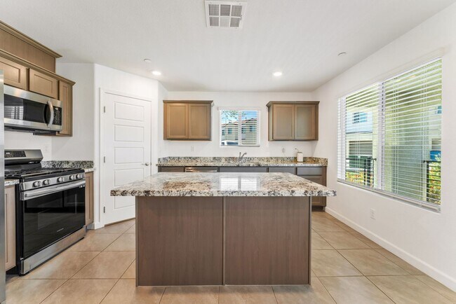 Building Photo - Modern Gated Townhome Living with Resort-Style Community Amenities