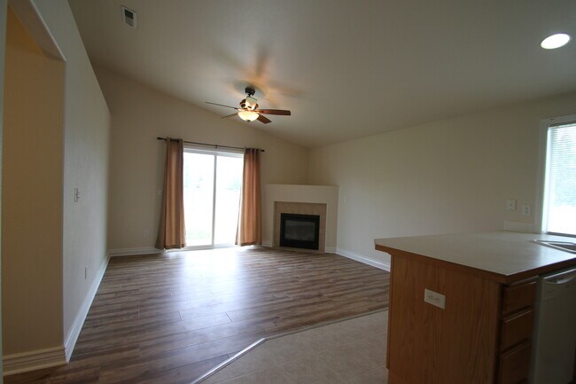 Second living area with fireplace and door to backyard. Could be used as family room o - 9624 Spencer Ct