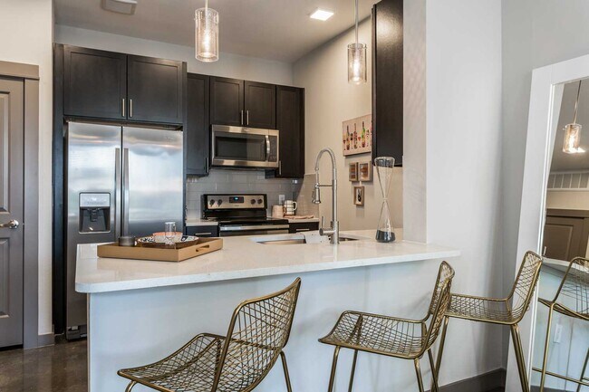 Building Photo - Your Downtown Lifestyle Begins Now