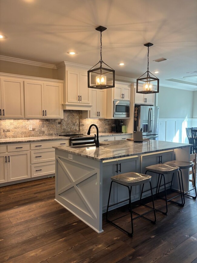 Building Photo - Spacious 4BR/3BA Creekside West Home with Screened Porch, Fenced Yard & 3-Car Garage