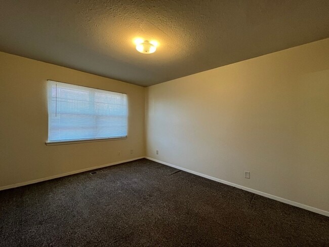 Building Photo - Sheridan Duplexes 01-03