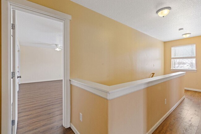 Building Photo - SPACIOUS LAYOUT! HARD SURFACE FLOORING, FENCED YARD & LARGE PATIO!