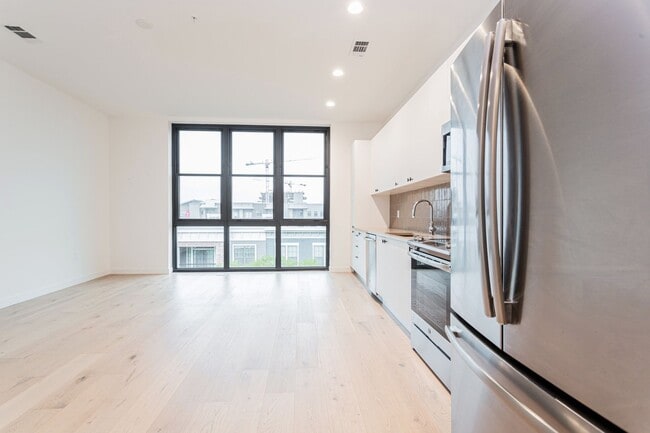 Building Photo - Light-Filled 2 Bed / 1 Bath – Wide-Plank Hardwood & W/D Included