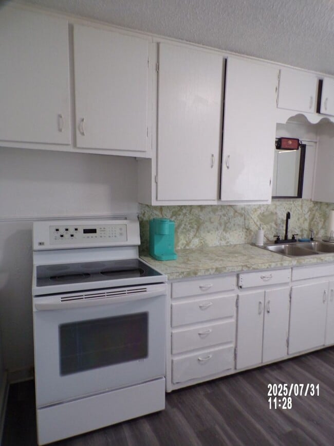 Building Photo - NEW listing-refinished hardwood floors, new laminate and paint throughout