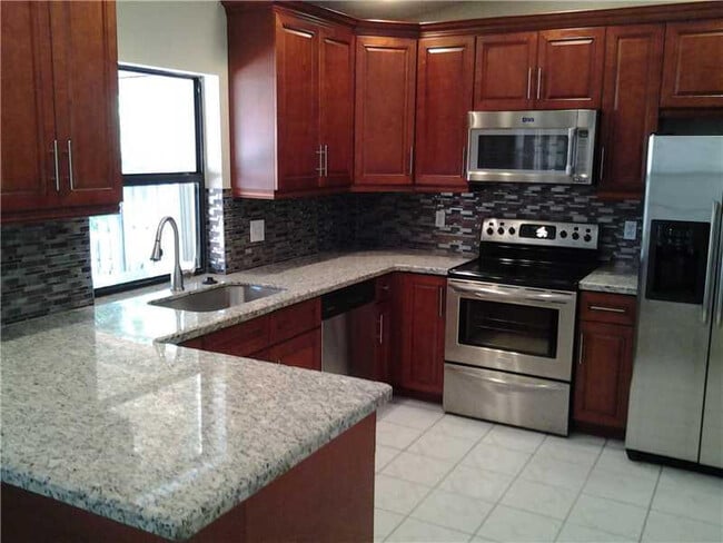 Building Photo - 9620 NW 42nd Ct